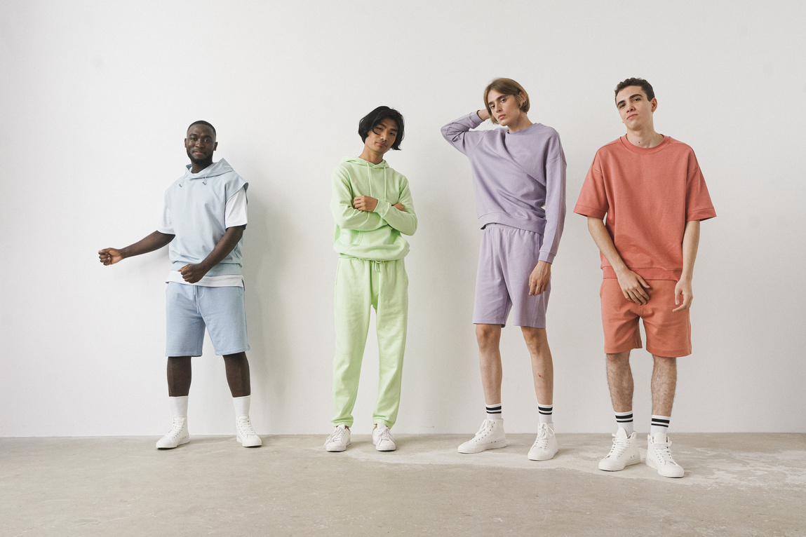 Four Male Models Posing on White Background