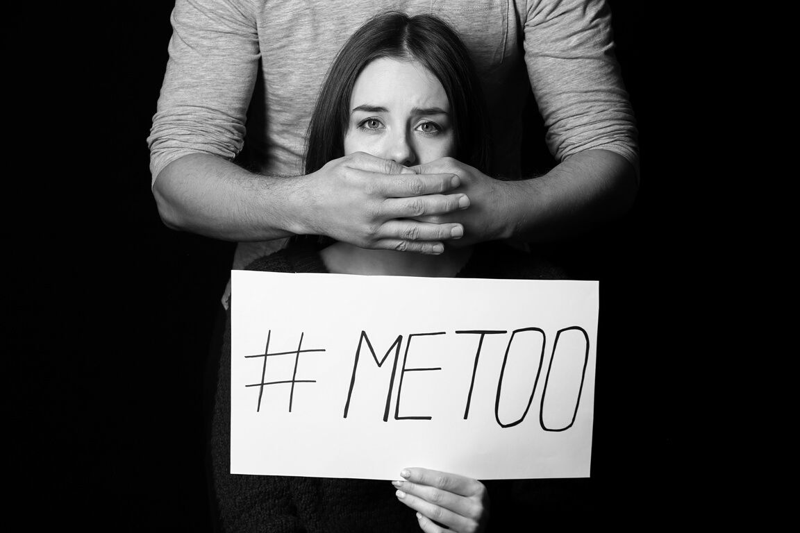 Man and His  Holding Paper with Hashtag MeToo on Dark Background